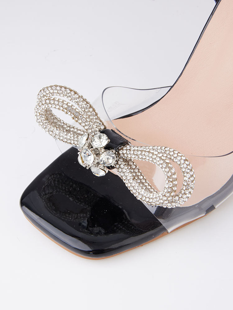 Glitzernde High Heels mit eckiger Zehenpartie und Schleife