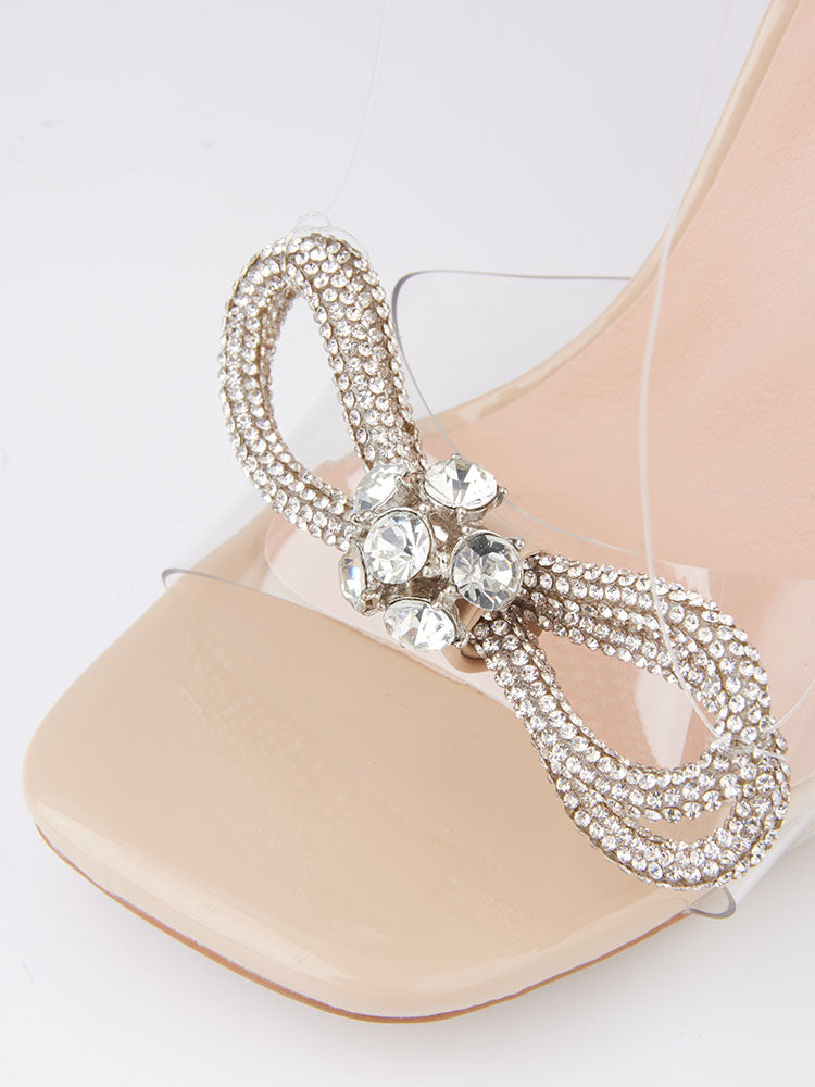 Glitzernde High Heels mit eckiger Zehenpartie und Schleife