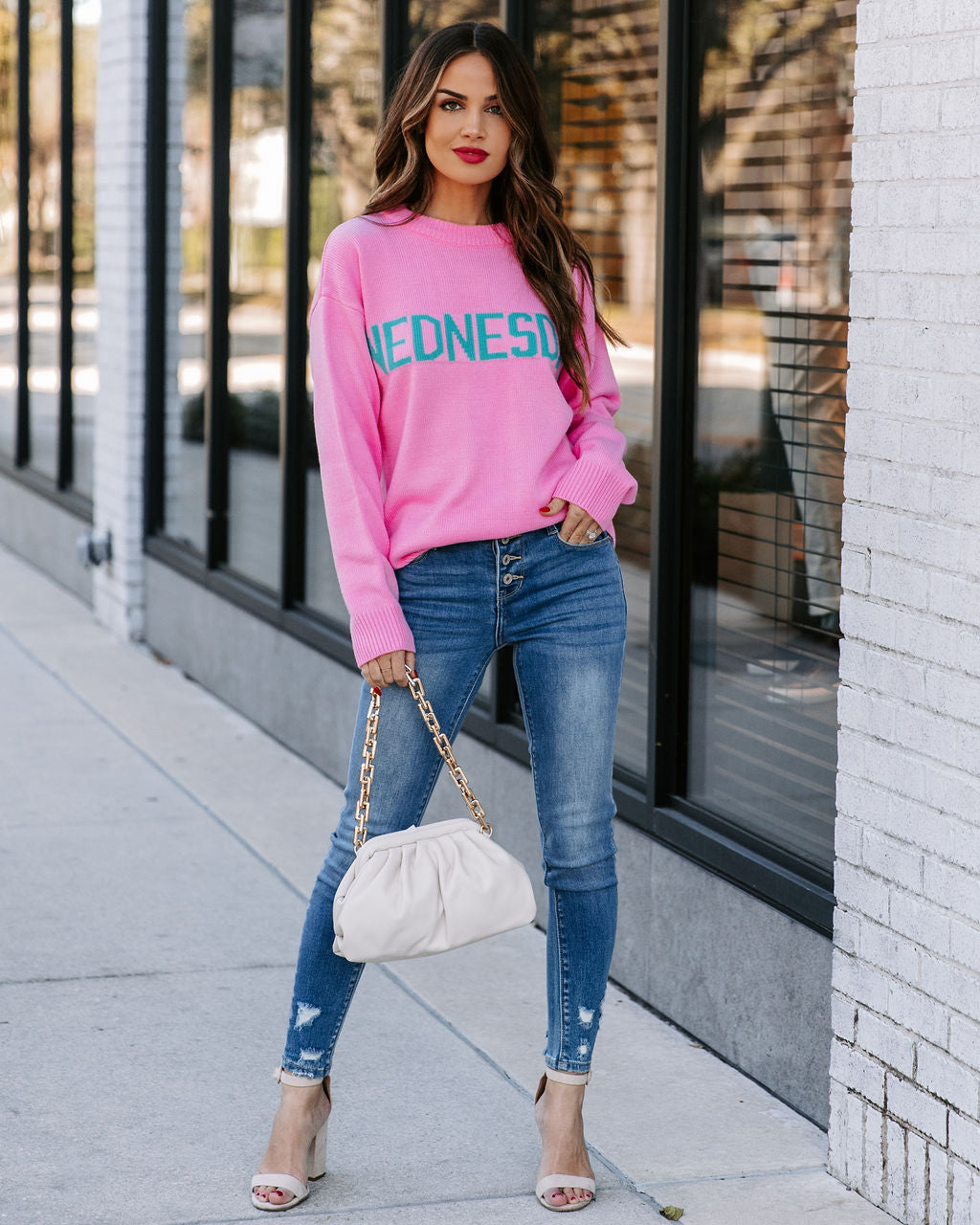 Wednesday Wearing Pink Knit Sweater