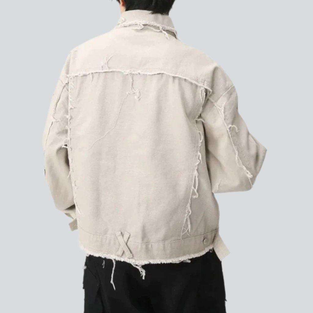 Light color distressed denim jacket