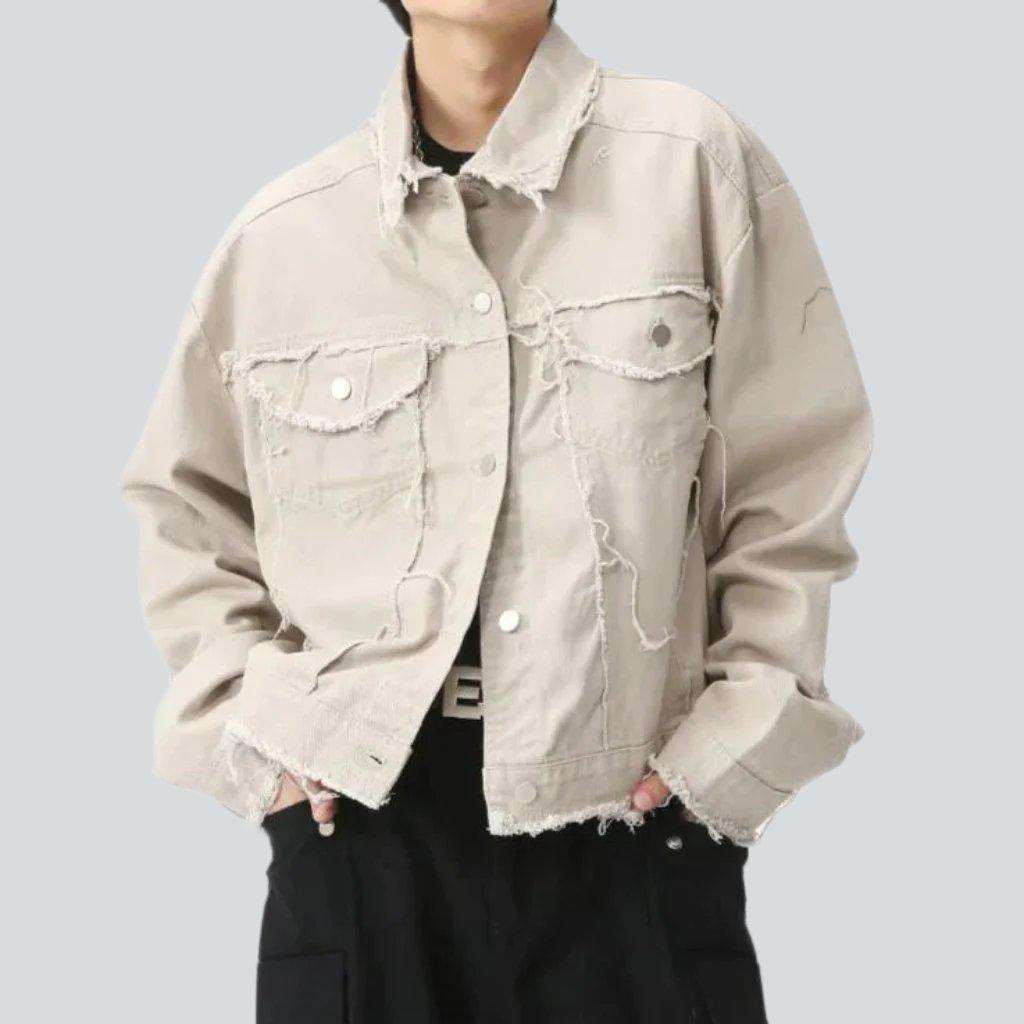 Light color distressed denim jacket