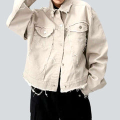 Light color distressed denim jacket